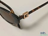 a close up of a pair of sunglasses on a table