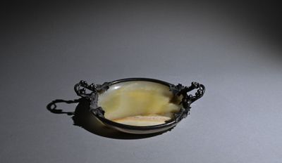 a picture of a piece of jewelry that is sitting on a table