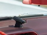 a close up of a car ' s dashboard with a microphone attached to it