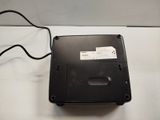 a black laptop computer sitting on top of a white table