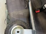 a wheel that is attached to the seat of a car
