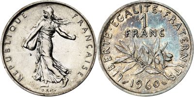 a silver coin with a woman holding a flower on it