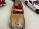 a lot of toy cars that are sitting on a table