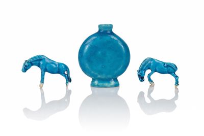 three pieces of blue glass with a horse on it