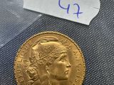 a close up of a gold coin with a label on it