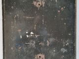 an old metal door with a number on it