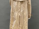 the back of a beige trench coat on a mannequin mannequin mannequin mannequin mannequin mannequin mannequin manne