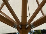 a large white umbrella with a chain hanging from it