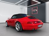 the red sports car is parked in the garage of the building