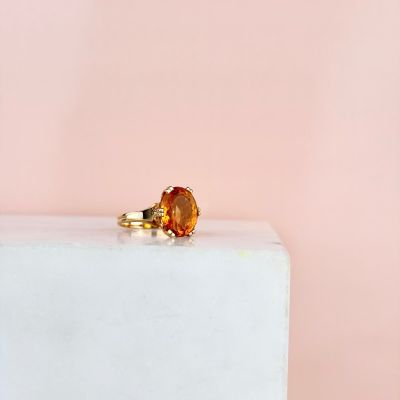 a close up of a ring on top of a white cake