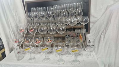 a lot of wine glasses on the table