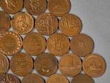 a lot of coins that are sitting on a table