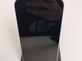 someone is taking a picture of their cell phone with a mirror