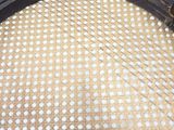 a close up of a chair with holes in the seat