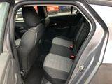 the interior of a car with the door open showing the front seats