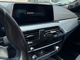 a car dashboard with a digital display in the center