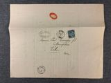 a piece of paper with a stamp on it sitting on a table