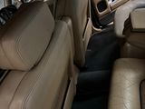 beige leather seats in the back of a car in a showroom