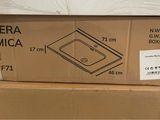 a cardboard box with a picture of a kitchen sink on top of it