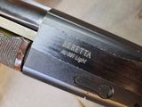 a close up of a gun that is on a table