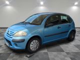 a picture of a blue car parked in a garage