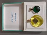 a box with a ring and a bottle of perfume in it