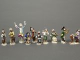 many figurines of people that are standing together