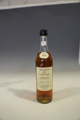 a bottle of whisky sitting on a counter