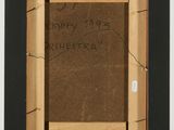 an old picture frame with a message written on it on a table