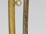 pair of gold - plated and silver - plated sabers, possibly from the late 19th century