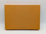 a brown box on a white surface with a white background