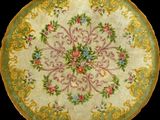 a close up of a plate with flowers on it on a black background
