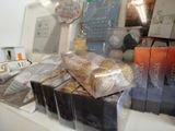 many bags of food on a counter in a store