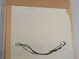 a picture of a piece of paper with a wire attached to it