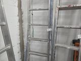 two ladders that are leaning against the wall in a room