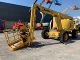 a yellow crane that is parked in a parking lot