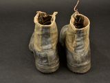 a close up of a pair of dirty boots