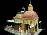 a model of a building with a clock on top of it
