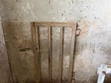 a dirty room with a metal grate in it