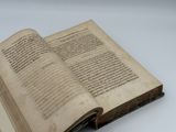 a book open on a table with a white background