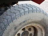 a close up of a tire on a flatbed truck