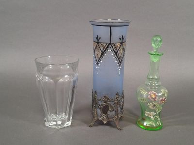 three glass vases sitting next to each other on a table