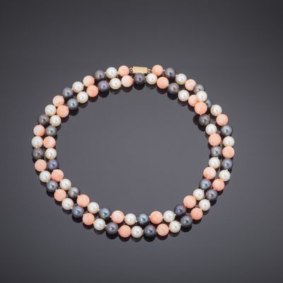 a multicolored beaded necklace with a gold clasp