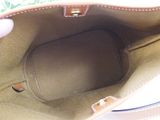 a hand holding a purse that is open on a table