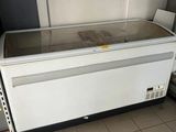 a refrigerator that is sitting in the corner of a room
