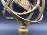 an image of a metal object on a table with a blue background