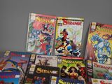 a lot of comic books on the table