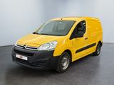 une camionnette jaune Citrole garée dans une pièce blanche au sol noir