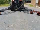 une image représentant un tracteur attelé à une remorque