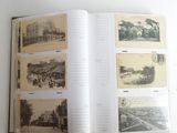 an open book with pictures of buildings and people on it
